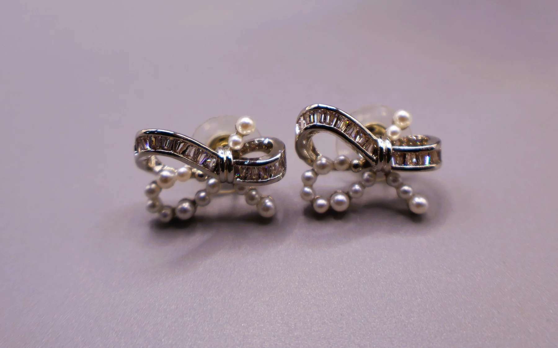 Pearl bow silver-tone baguette crystal stud earrings